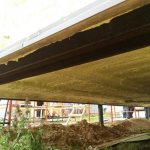 how to insulate the floor in a wooden house from below